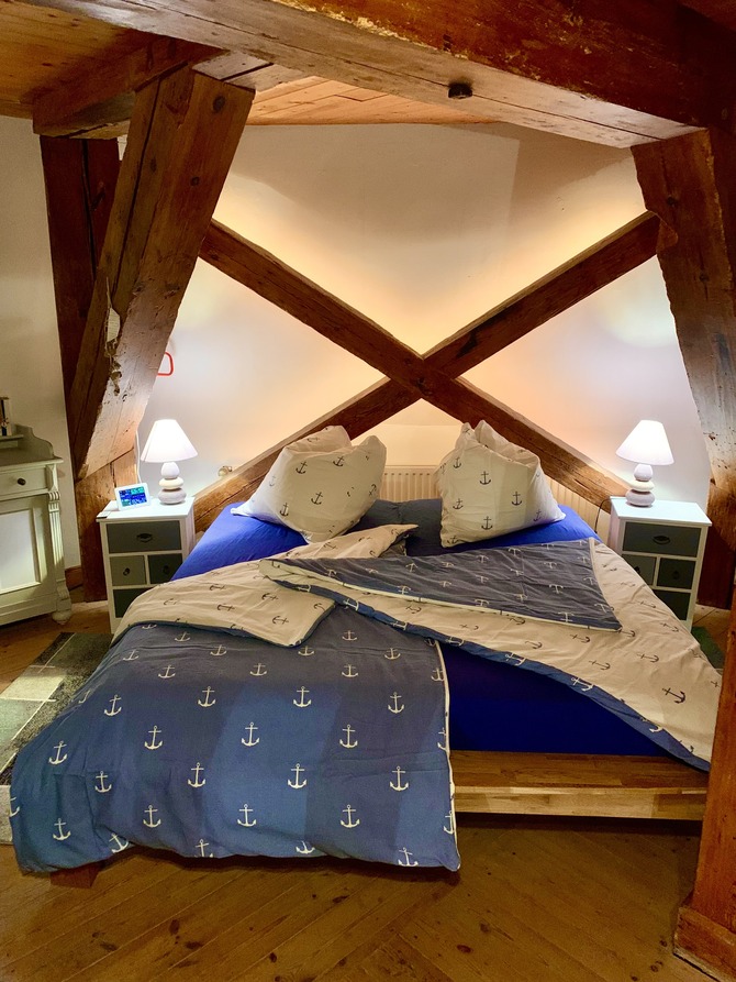 Ferienhaus in Lindau - Windmühle Lindaumühlenholz - Großes Doppelbett auf dem Mahlboden