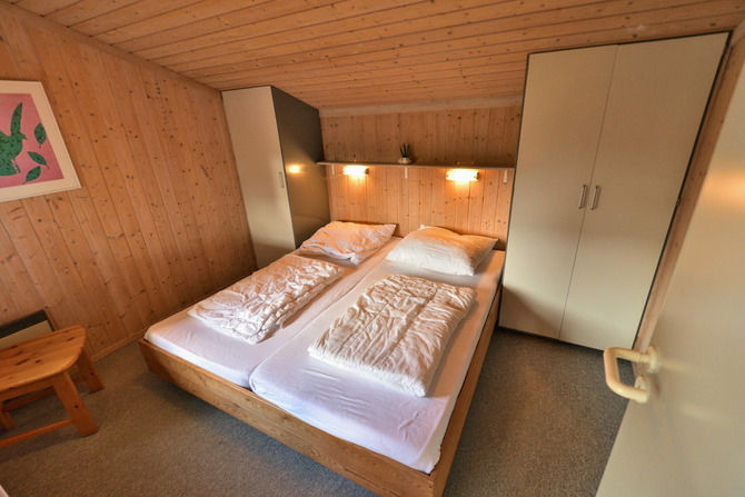 Ferienhaus in Pelzerhaken - Am Waldrand Haus A - Schlafzimmer mit Doppelbett