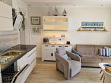 Ferienwohnung in Grömitz - Haus Solymar - Wohnbereich mit offener Küche, Klimaanlage